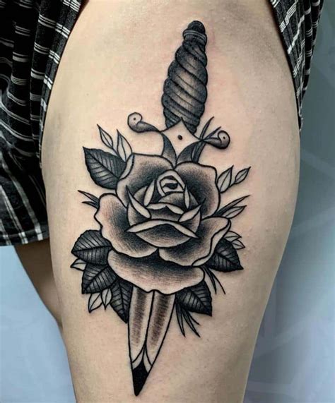 Rose and dagger tattoo - Nov 30, 2023 · A traditional rose and dagger tattoo typically features bold lines, vibrant colors, and iconic imagery. The dagger often pierces the rose, symbolizing the unity and interplay of love and pain, beauty and danger. Black and Grey Tattoos. A black and grey rose and dagger piece can be a striking choice for those who prefer monochromatic designs. 